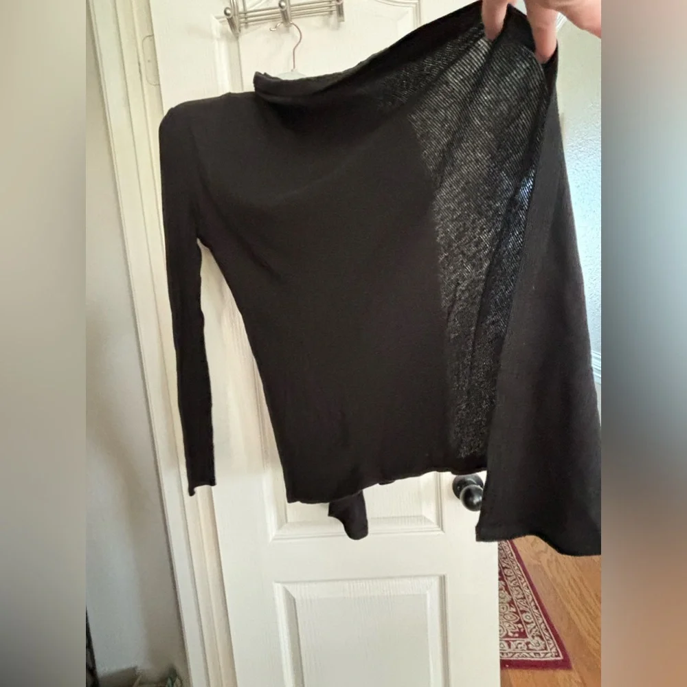 Fabletics wrap type cardigan. Size CS would for sure fit S and probably a medium